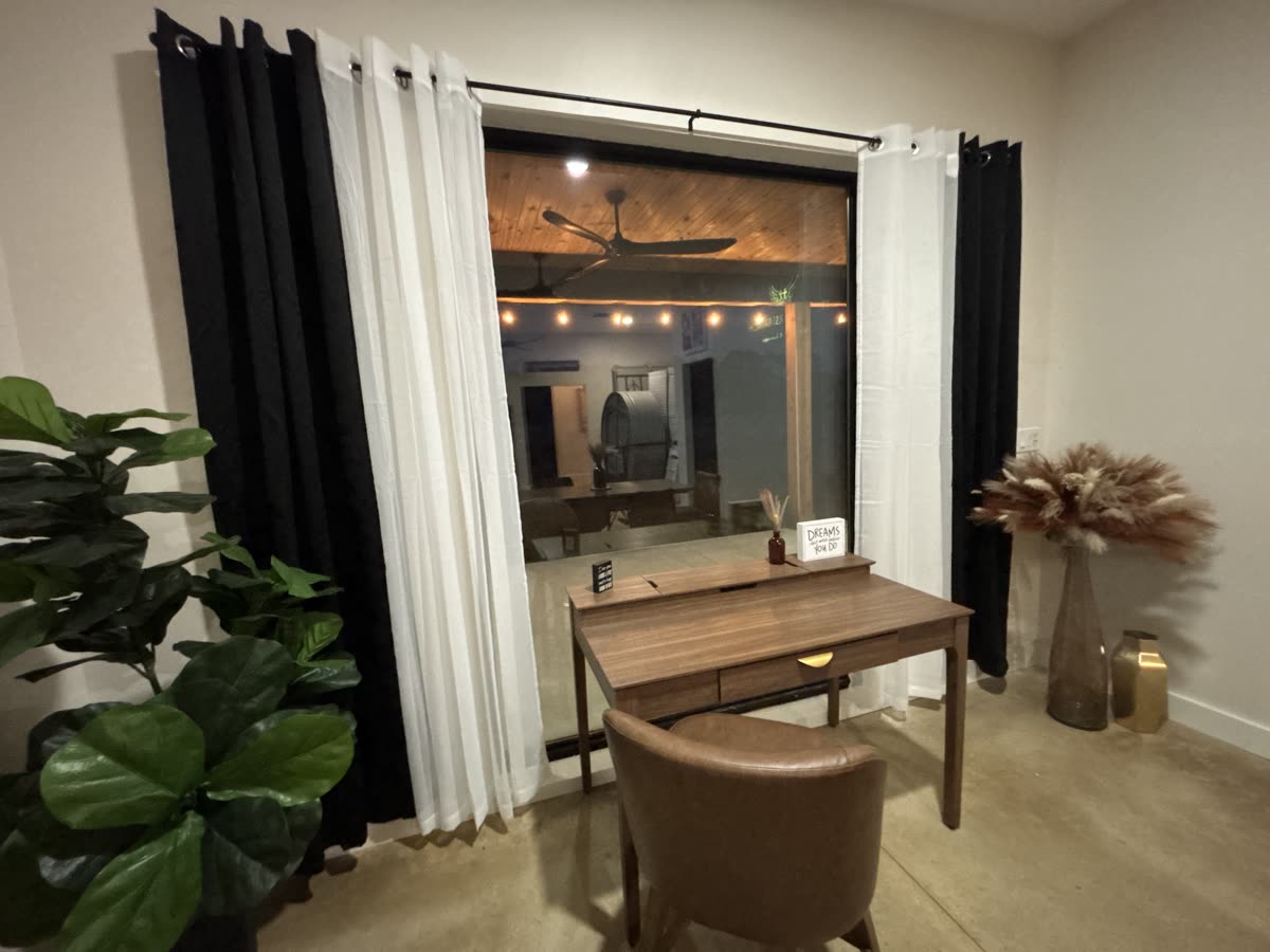 The Zen Room, a quiet curtained corner with a writing desk and soft lamplight
