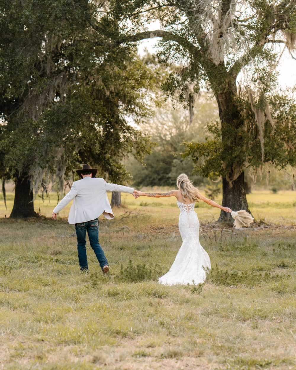 The paver aisle and ceremony benches framed by oaks